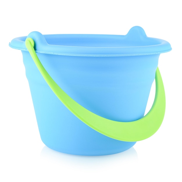 Blue toy bucket made of plastic or rubber closeup isolate on a white background Children's toys for playing in the sandbox or on the beach Development of fine motor skills of the child