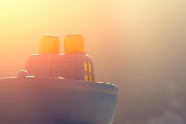 Blue toy ship with sunlight