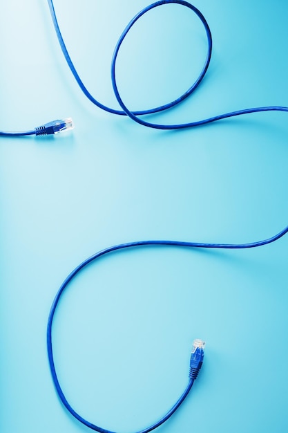 Blue UTP Internet Cable Isolated on a blue background Ethernet Cord