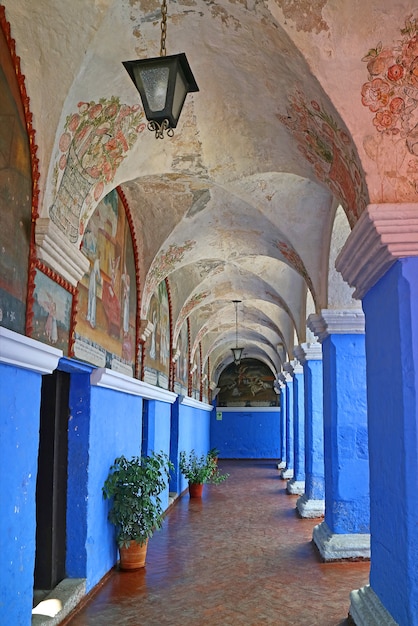 Blue Wall and Columns in Monastery of Santa Catalina with Religious Fresco Paintings, Arequipa, Peru