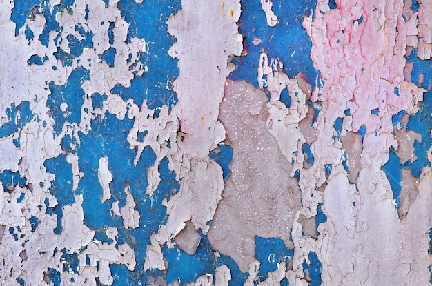 A blue wall with a pink and blue paint that says'the word'on it