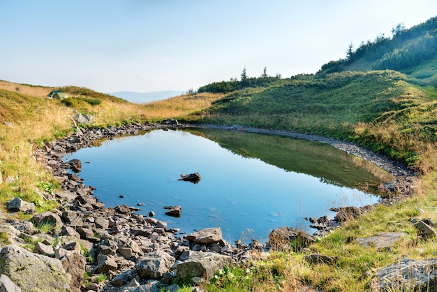 Blue water with rocks in a mountain lake