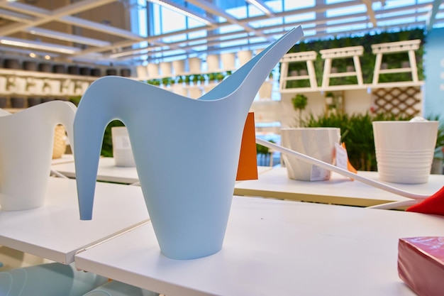 Blue watering can for watering indoor plants and flowers