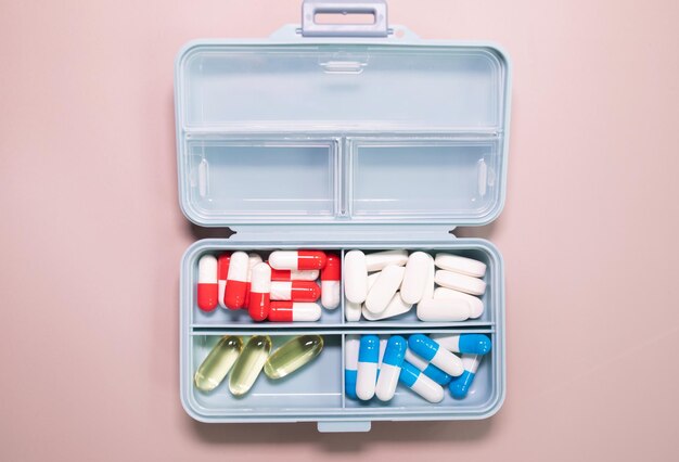 A blue and white container with pills inside of it.