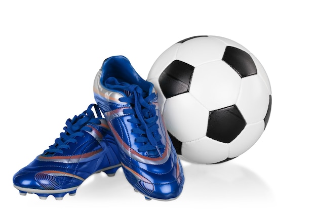 Photo blue and white football shoes and soccer ball, isolated