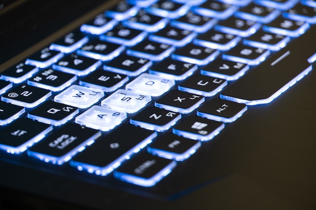 A blue and white Neon Sign in Form of a Keyboard.