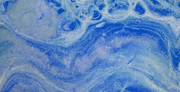 A blue and white painting of a blue swirly water.