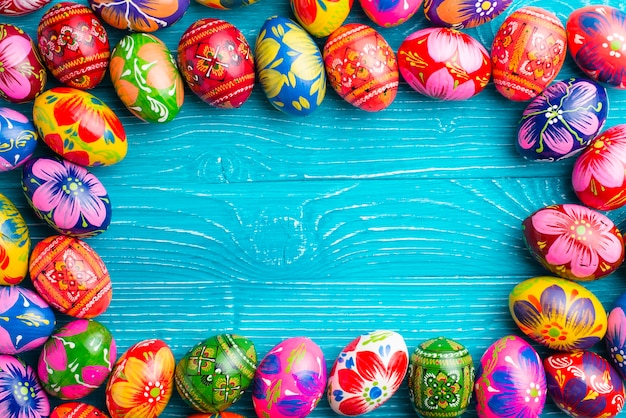 Blue wooden surface with easter eggs frame