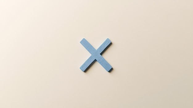 Photo a blue x is on a white surface