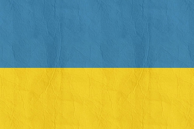 Blue and yellow flag of ukraine with a gold stripe.