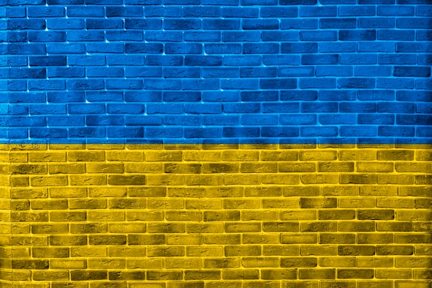 A blue and yellow ukraine national flag painted on the wall