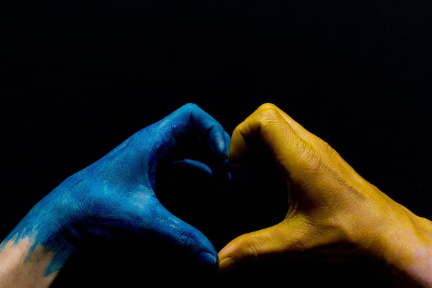 Blue and yellow ukrainian hands isolated symbolic