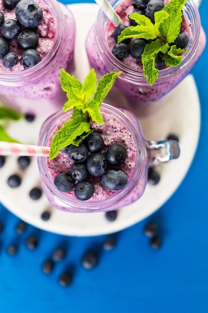 Photo blueberrie smoothie made with fresh organic blueberries and plain yogurt.