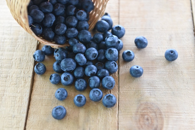 Blueberries basket in a wooden table - fresh blueberry tasty fruit