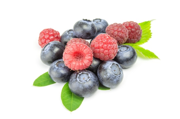 Blueberries and raspberries isolated on white cutout.