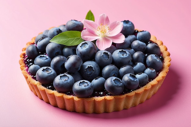 Blueberries tart decorated with alstroemeria flower against pink background