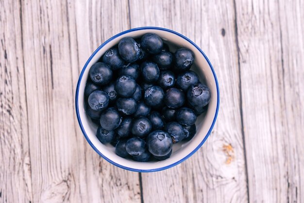 Blueberry berry in a round cup