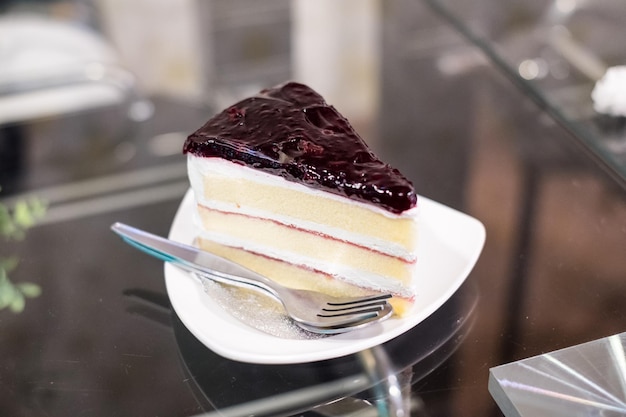 Blueberry Cheese Cake with cream on table