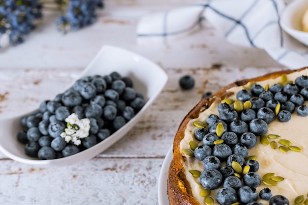 Blueberry cheesecake with blueberries and pumpkin seeds