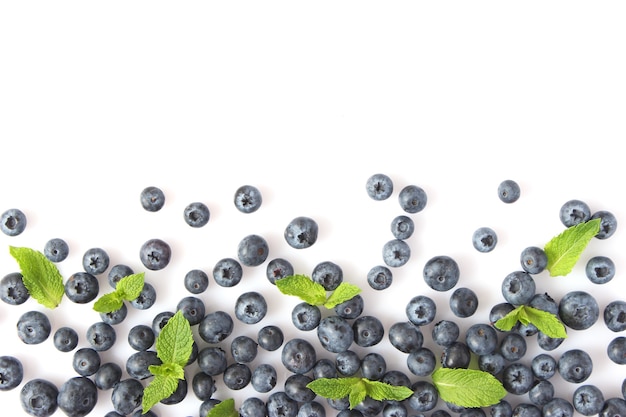 Blueberry and mint leaves on a white background top view place for text