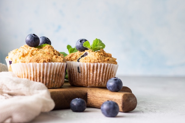 Blueberry muffins with fresh berries and mint