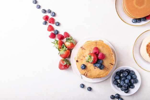 Blueberry pancakes served with honey