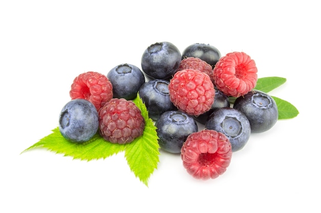 Blueberry and raspberries isolated on white background cutout.