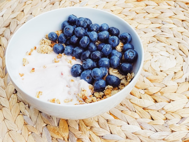 Blueberry yogurt cereal bowl as healthy breakfast and morning meal sweet food and organic berry frui