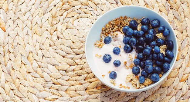 Blueberry yogurt cereal bowl as healthy breakfast and morning meal sweet food and organic berry fruit diet and nutrition