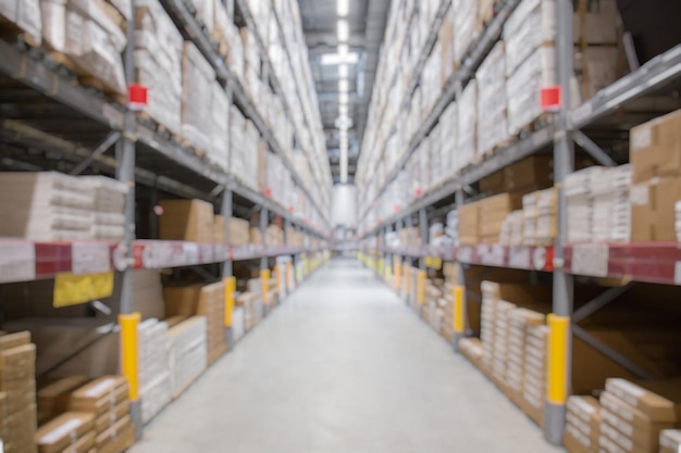 Blur background of shelves with goods boxes in modern industry warehouse store