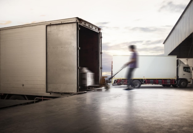 Blur Motion of Worker Unloading Cargo Pallets to Cargo Container Shipping Trucks Logistics Transport