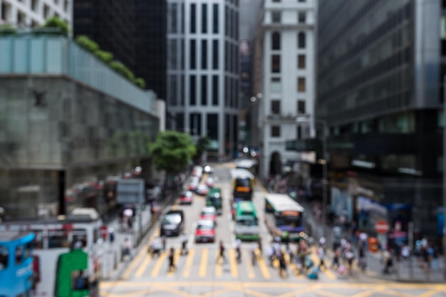 Blur of people crossing the road in business district