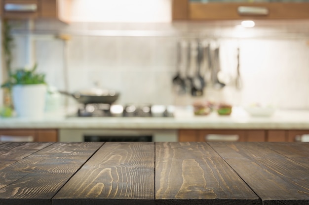 Blurred abstract background. Modern kitchen with tabletop and space for display your products.