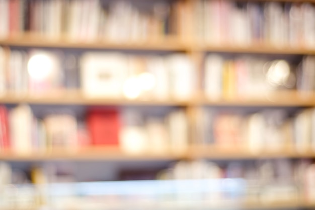 Photo blurred background, blur bookshelves at book store background, education concept