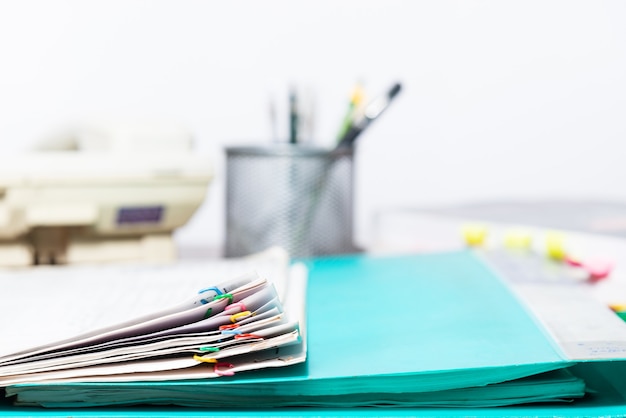 Blurred background of document paper and files folder on office desk