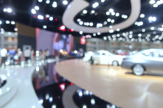 Blurred background of people attending in motor show exhibition event on Bangkok Thailand