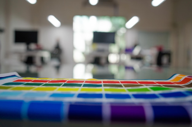 A blurred background photo of the inside of printing sublimation room Color Palette Guide