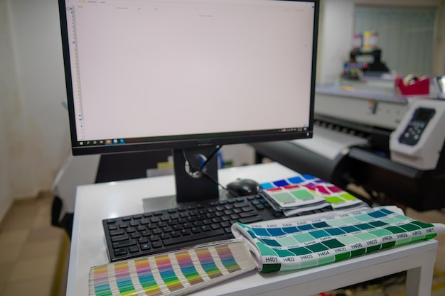 A blurred background photo of the inside of printing sublimation room Color Palette Guide