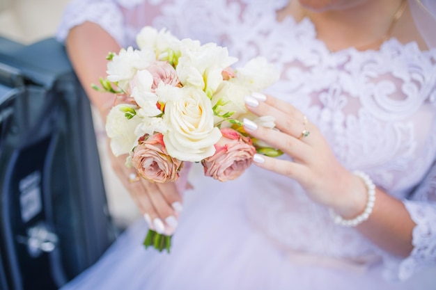 Blurred background wedding theme brides bouquet and hands closeup Wedding day