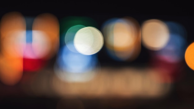 Blurred background with multicolored bokeh in night city