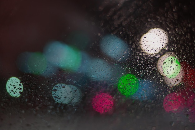 Blurred background with raindrops and lights