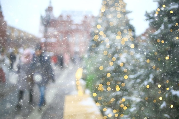 blurred background, xmas tree outside, decorated snow background, new year