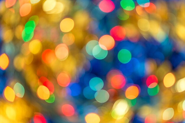 Blurred bokeh christmas lights with New Year ornaments in warm tone background