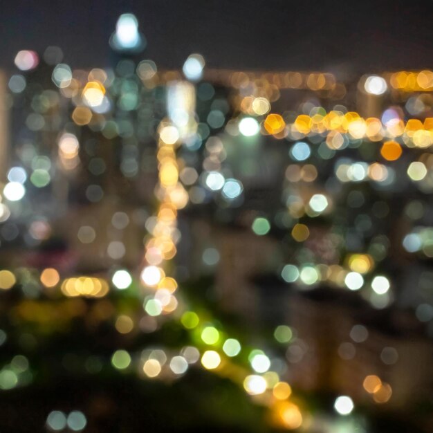 Photo blurred bokeh of city background at night time