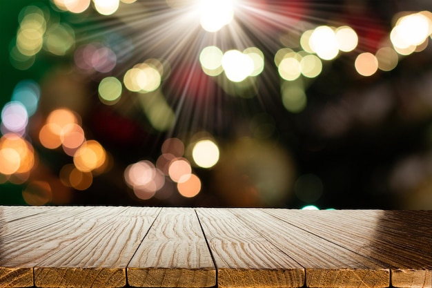 Blurred Christmas background with empty wooden table in focus Empty display for product assembly