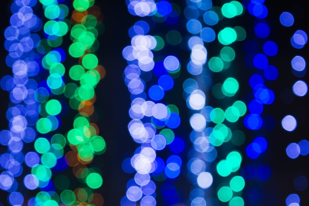 Blurred christmas lights abstract background winter holiday design with bokeh