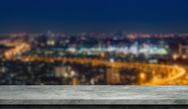 Blurred city background with cement floor for display products.