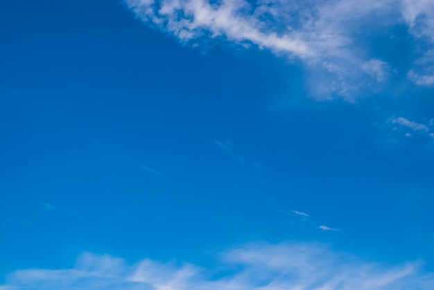 Photo blurred clouds, sky during in morning. blue,white pastel heaven,soft focus lens flare sunlight.