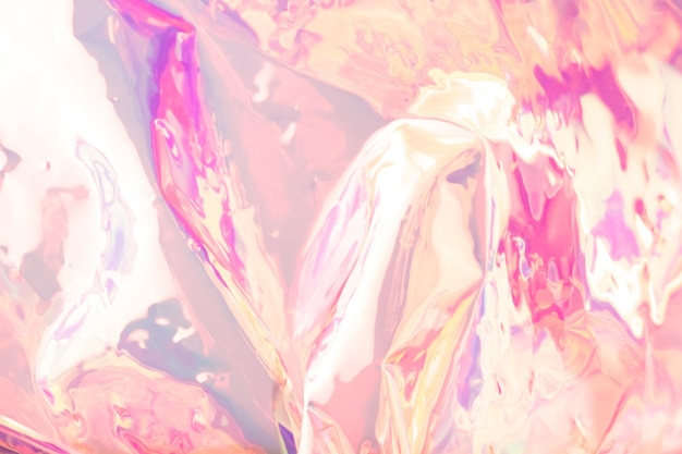 Blurred colorful holographic background in pink colors