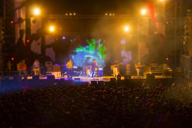 Blurred image of audience in free night music festival no charge admission.